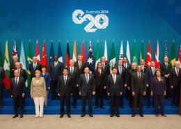 Discuss the role of the G20 in shaping global economic policies. How do both advanced and emerging economies influence and contribute to the G20’s objectives? Provide examples of key initiatives or agreements that have emerged from G20 meetings and analyze their impact on the global economy.